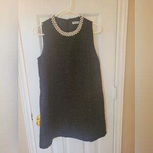 Elegant Black Sleeveless Top with Pearl Detail